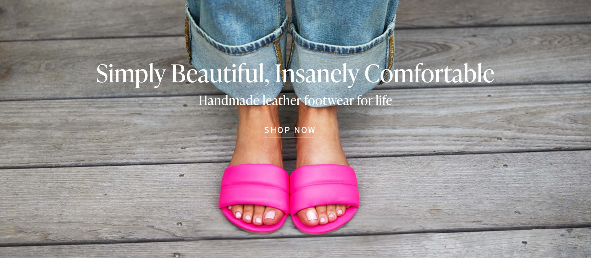 Woman wearing Sugarbird leather slide sandals in azalea with text overlay "Simply Beautiful, Insanely Comfortable; Handmade leather footwear for life" and Shop Now button.