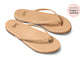 Sunbeam leather flip flop sandal in beach - angle shot - with "as seen in Travel + Leisure" press bubble