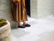 Woman wearing Albatross leather platform sandal in black with patterned dress