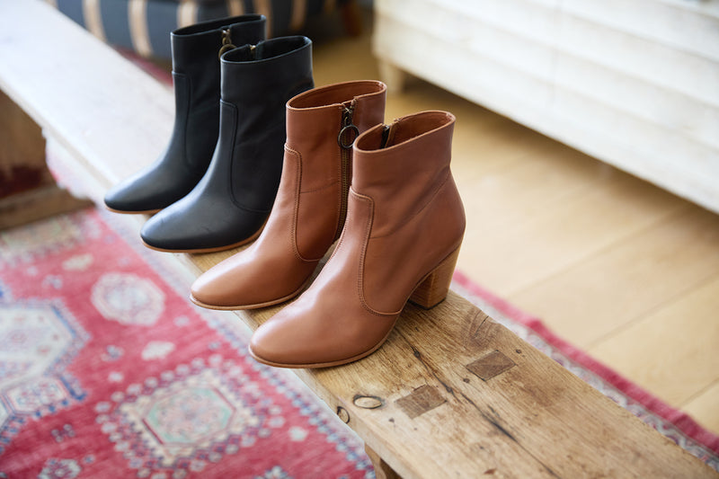 Group shot of Catbird leather boot in black in cognac and black