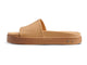 Chick leather platform slide sandals in beach - side shot