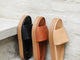 Chick leather platform slide sandals in black, tan, and beach.