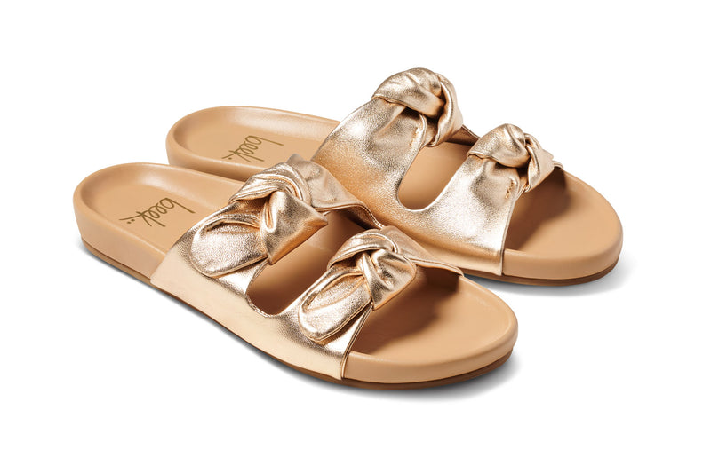 Coquette leather slide sandals in gold/beach - product angle shot