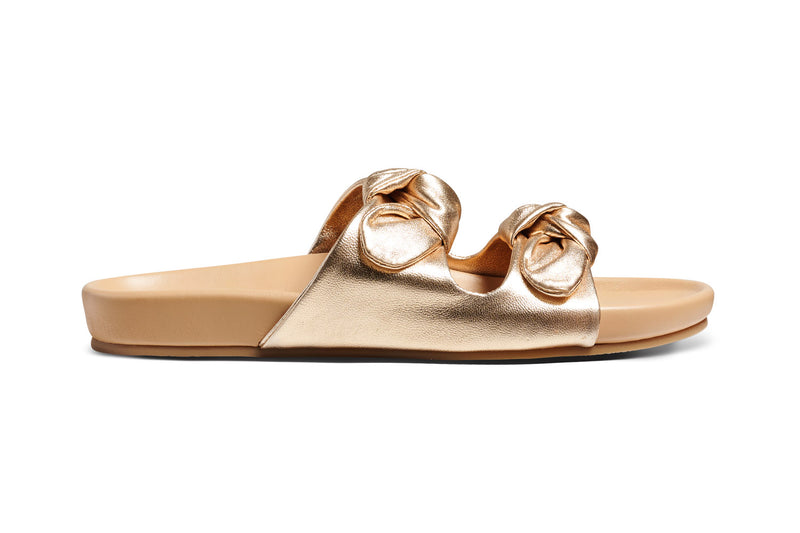 Coquette leather slide sandals in gold/beach - product outer side shot