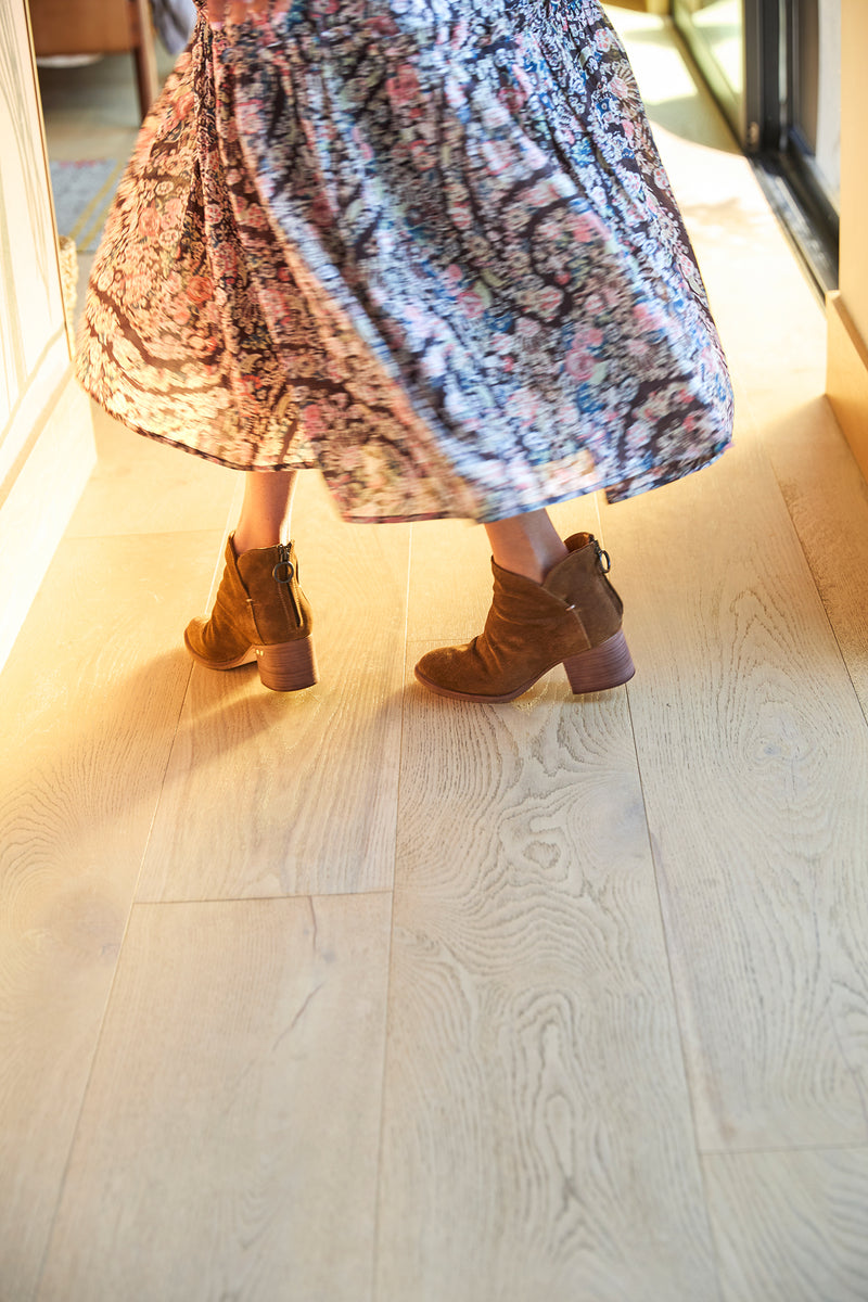 Woman wearing Eagle suede boots in chestnut with floral dress