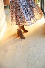 Woman wearing Eagle suede boots in chestnut with floral dress