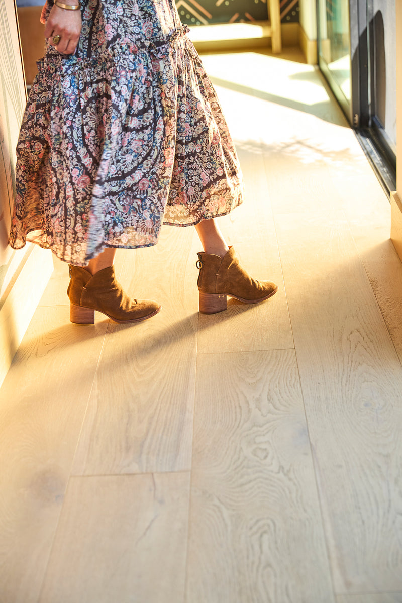 Woman wearing Eagle suede boots in chestnut with floral dress