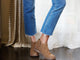 Woman wearing Falcon suede booties in chestnut with jeans and sweater.