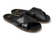 Fernbird leather slide sandals in black - product angle shot