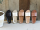 Gallito leather slides in black, platinum, honey, platinum/beach, and tan.