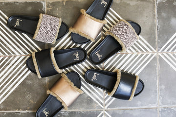 Group shot of Gallito Shearling leather slide sandals in mocha/black, multi-black, black.