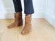 Woman wearing Grouse slouchy leather boot in chestnut with jeans