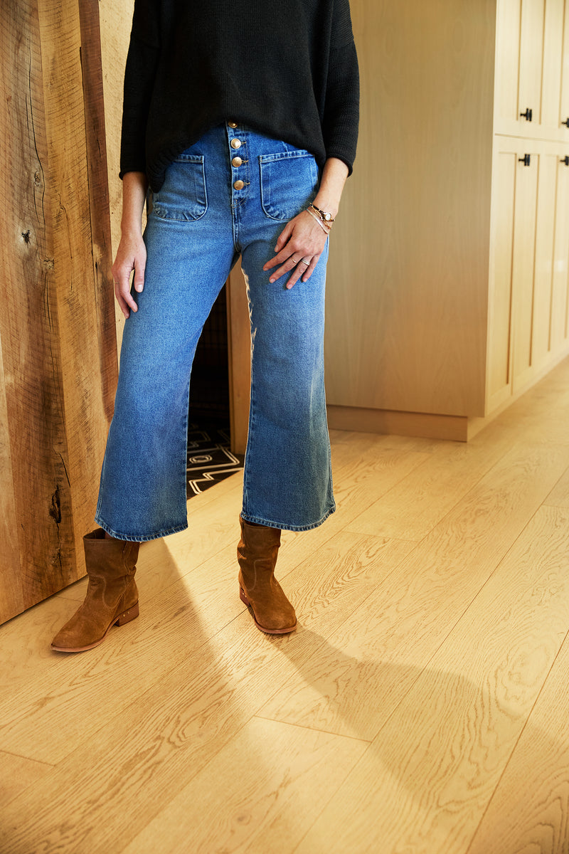 Woman wearing Grouse slouchy leather boot in chestnut with jeans