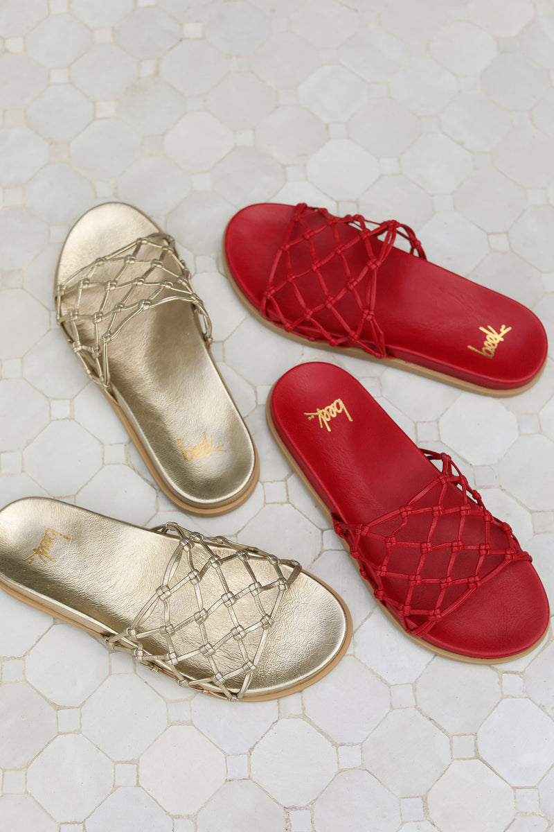 Group shot of Harpy leather slide sandal in gold and lipstick