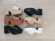 Group shot of Inca platform heel sandals in beach, tan, black with Prinia platform heel sandals in black, beach, eggshell.