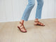 Woman wearing Miner leather studded sandals in tan