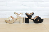 Group shot of Partybird platform heeled sandals in gold and black