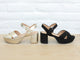 Group shot of Partybird platform heeled sandals in gold and black