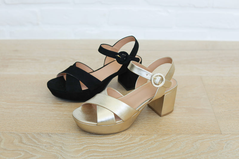 Group shot of Partybird platform heeled sandals in black and gold