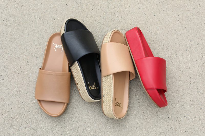 Group shot of Pelican leather slide sandals in honey and lipstick with Pelican Jute slide sandals in black and beach