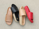 Group shot of Pelican leather slide sandals in honey and lipstick with Pelican Jute slide sandals in black and beach