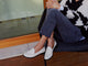 Woman wearing Pepper leather loafer in eggshell with jeans and sweater