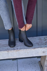 Woman wearing Pheasant leather boots in black with jeans and sweater