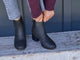 Woman wearing Pheasant leather boots in black with jeans and sweater