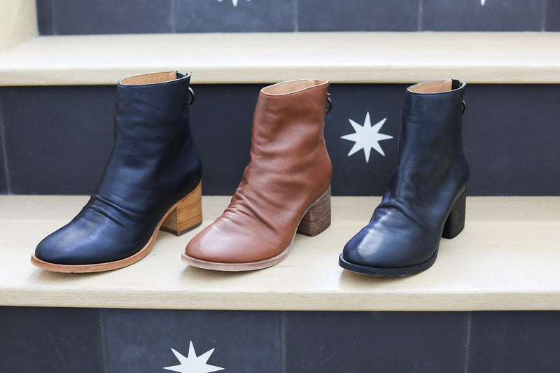 Group shot of Pheasant leather boots in black/tan, cognac, and black.