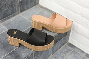 Group shot of Prinia Jute platform heel sandal in black and beach on steps