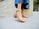 Woman wearing Sapphire block heel sandal in honey with denim dress