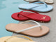 Group shot of Sunbeam leather flip flop sandals in glow, vanilla/beach, lipstick, sky, platinum, tan, and rose gold