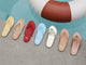 Group shot of Sunbeam leather flip flop sandals in glow, vanilla/beach, lipstick, sky, platinum, tan, and rose gold by the pool