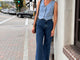 @abbiecrane wearing Swiftlet leather ballet slippers in honey with jeans, denim vest, and hat