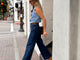 @abbiecrane wearing Swiftlet leather ballet slippers in honey with jeans, denim vest, and hat