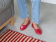 Woman wearing Swiftlet leather ballet shoes in lipstick with jeans