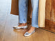 Woman wearing Swiftlet leather ballet slipper in silver with jeans and coat