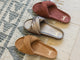 Group shot of Tesia slide sandal in almond suede, mocha leather, fig suede.