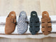 Group shot of Tody suede slide sandal in chestnut  and moss, Vulture suede slide in leopard and chestnut