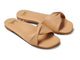 Whipbird leather slide sandal in beach - angle shot